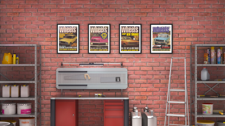 Garage wall with framed retro Wheels magazine covers