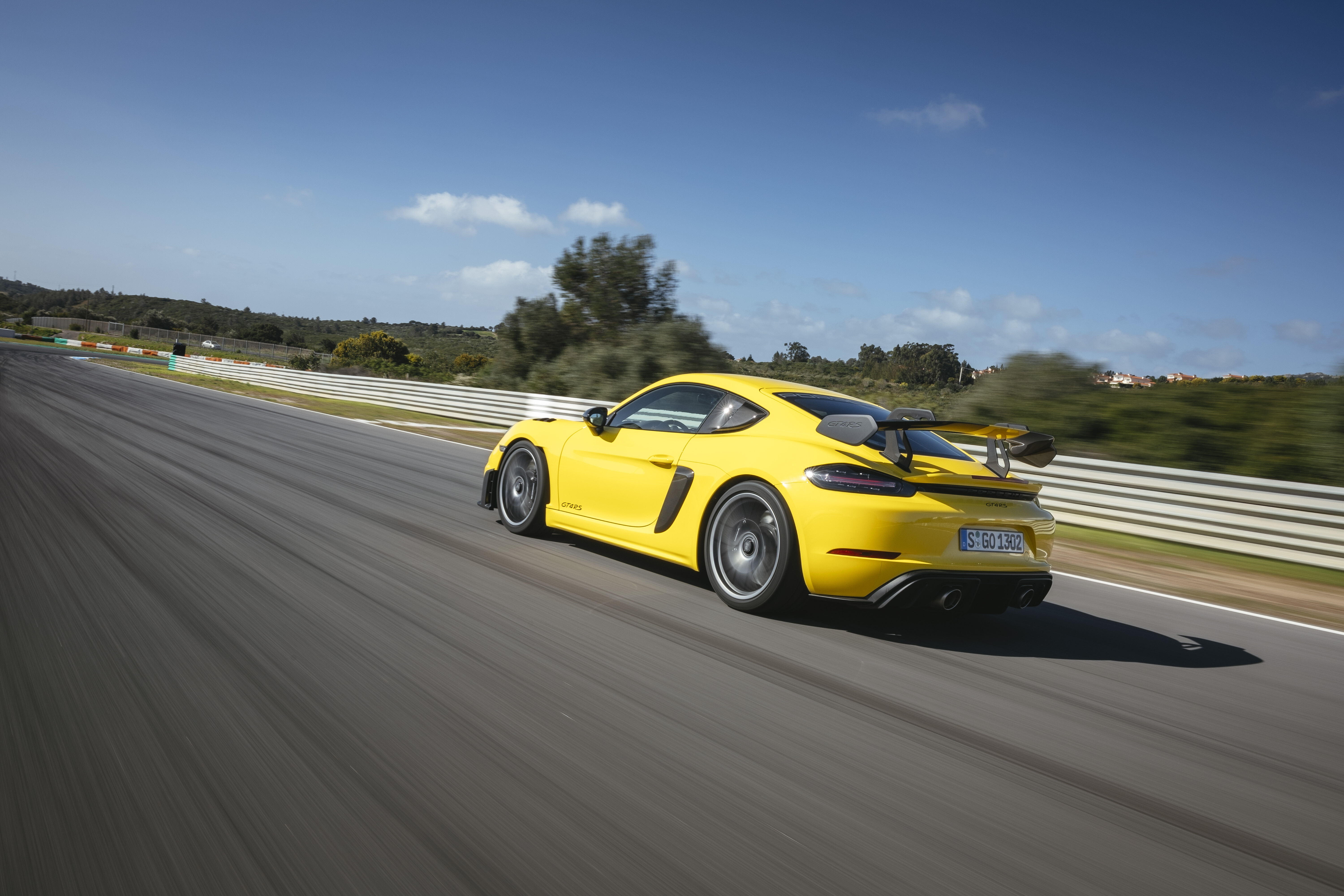 Motor Reviews 2022 Porsche 718 Cayman GT 4 RS Weissach Package Racing Yellow EU Spec Dynamic Rear 1