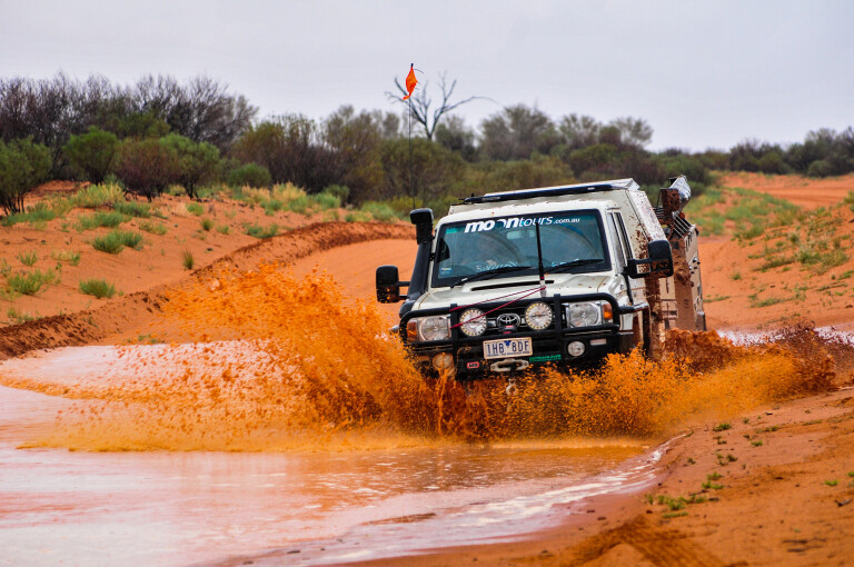4 X 4 Australia Explore Splashing Thru A Mud Puddle