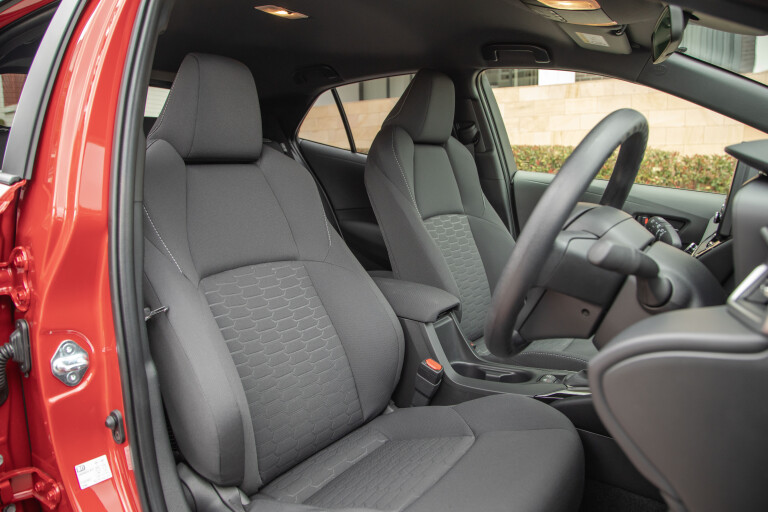 Wheels Reviews 2021 Toyota Corolla Ascent Sport Hybrid Jasper Red Interior Front Seat Design