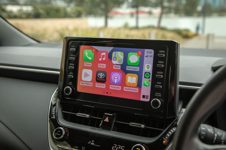 Wheels Reviews 2021 Toyota Corolla Ascent Sport Hybrid Jasper Red Interior Infotainment Screen Car Play Menu