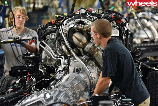 Ford -factory -worker -assembles -Ford -engine