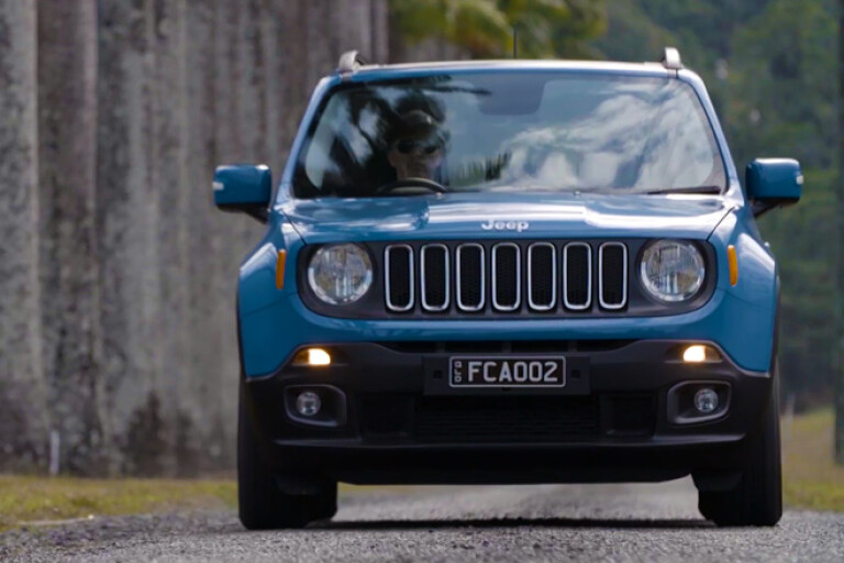 Blue Jeep Renegade driving