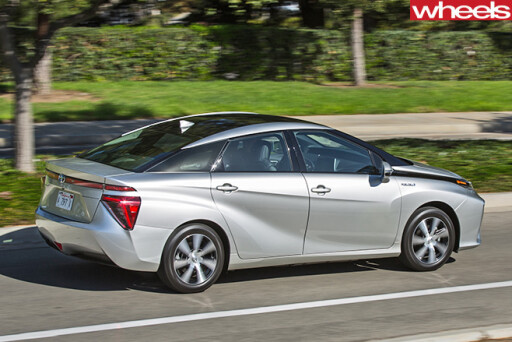 Silver -Toyota -Mirai -driving -rear