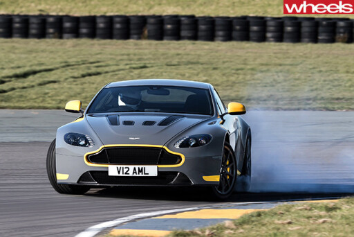 Aston -martin -vantage -gt 8-driving -front -smoking -tyres