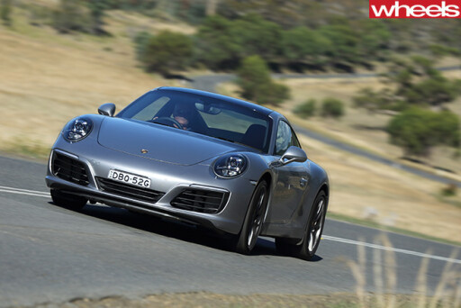 Porsche -911-Carerra -C2-S-Coupe -driving -front -side
