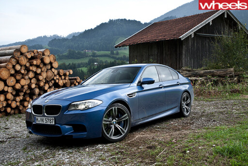 BMW-M5-driving -in -Germany -front -side -parked