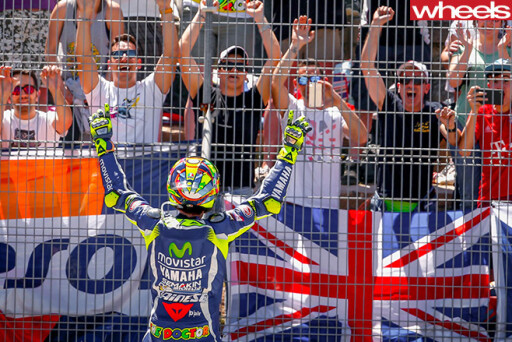 Rossi -celebrating -at -fence