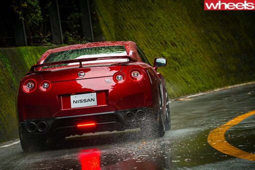 Nissan -GT-R-rear -driving -in -rain