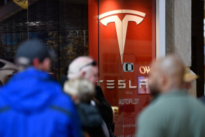 Tesla posts record loss as Model 3 production taps the brakes