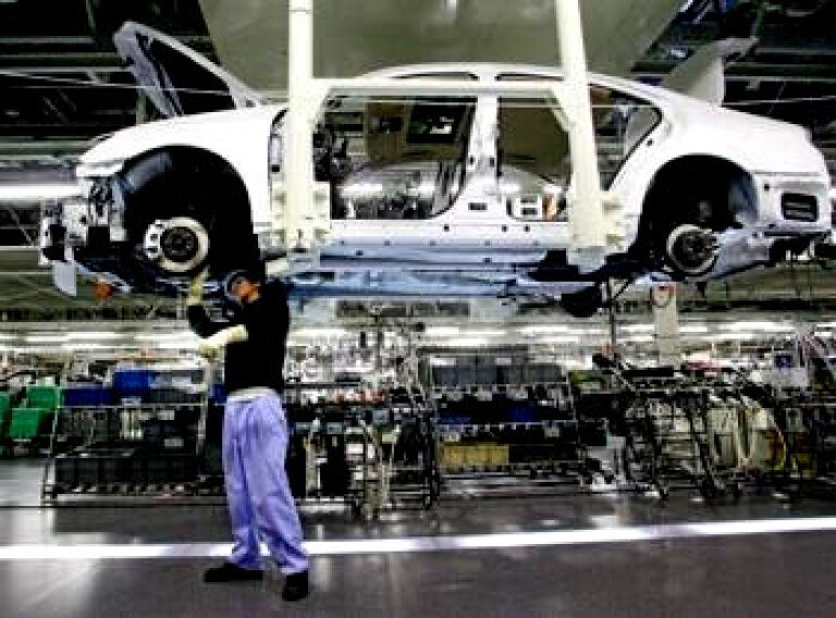 Toyota halves production, shuts manufacturing plants