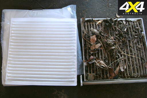 Check and clean a vehicle's air filter before a trip.