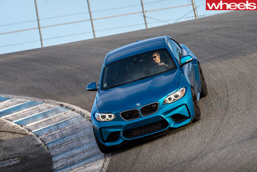 BMW-M2-driving -around -a -track -front