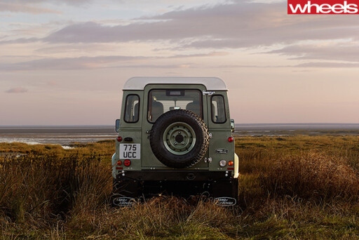 Land -Rover -Defender -driving -rear