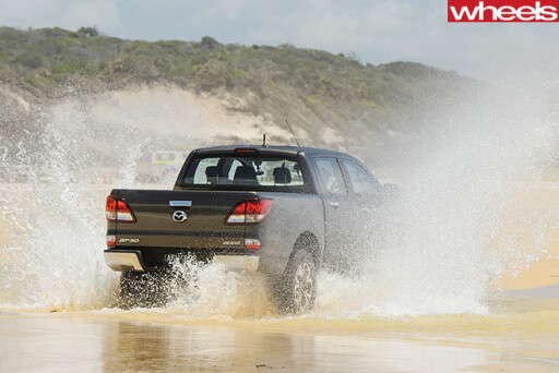 Mazda -BT-50-rear -driving -through -sand -water