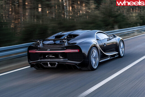Black -Bugatti -Chiron -driving -rear-