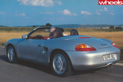 1996-Porsche -Boxster -986-driving -top -rear