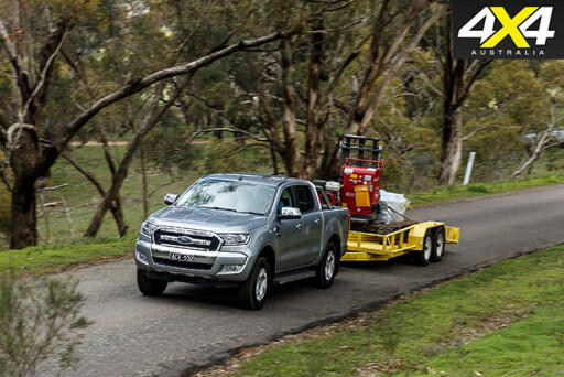 Ford Ranger driving with trailer on road