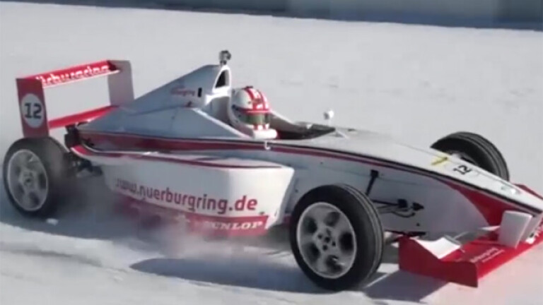 Formula racer laps snow-covered Nurburgring