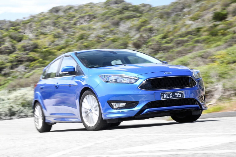 Ford Focus Sport Blue Driving Front Jpg