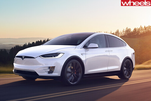 Tesla -Model -X-driving -sunset