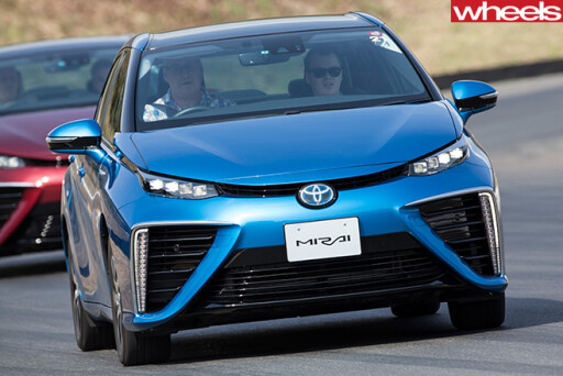 Blue -Toyota -Mirai -hydrogen -fuel -cell -vehicle -entering -corner-