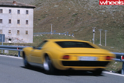 Yellow -Lamborghini -Muira -driving -rear