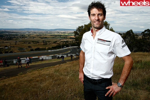 Mark -Webber -race -car -driver -posing -at -track