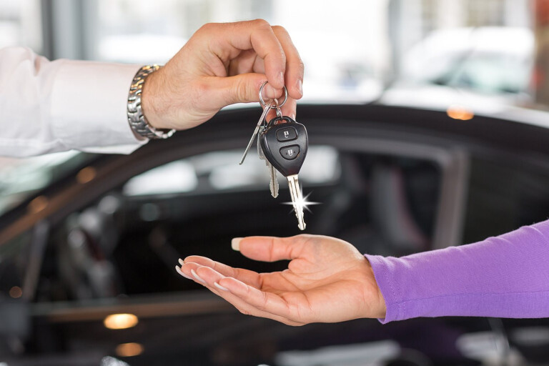 Car Salesperson Handing Over Keys To New Car Jpg