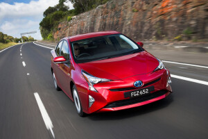 Toyota Prius Driving Around Front Side Jpg