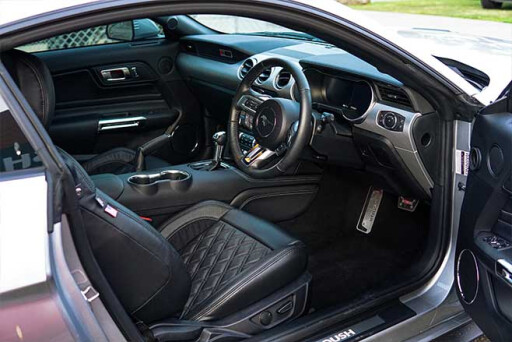 Supercharged Ford Mustang interior with quilted seats.