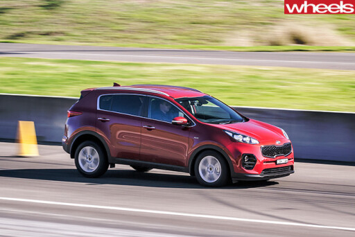 Kia -Sportage -driving -front -side