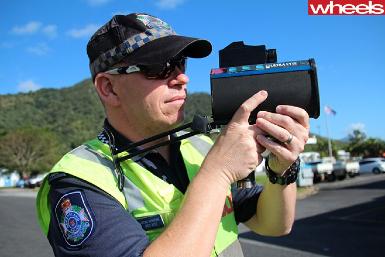 police officer with speed camera