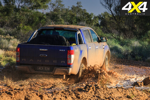 Ford ranger driving mud rear view