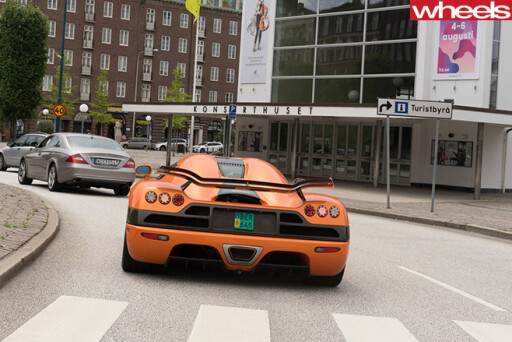 Orange -Koenigsegg -supercar -rear -driving