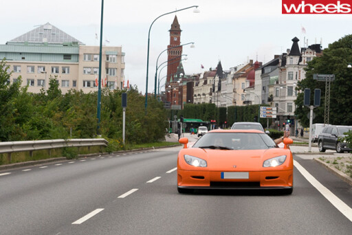 Orange -Koenigsegg -supercar -driving -street