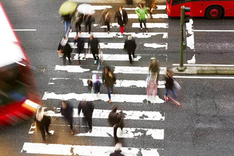 Pedestrians crossing road at Zebra crossing