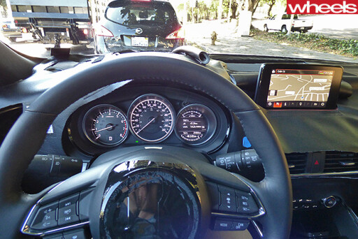 Disguised -Mazda -CX-9-drive -interior