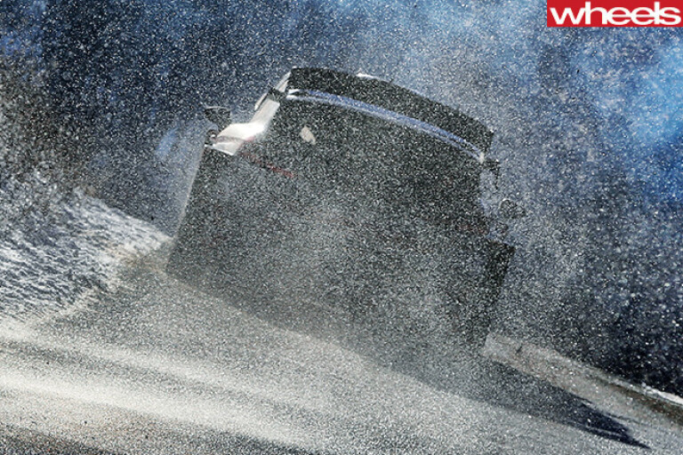 Hyundai -i 20-rally -car -kicking -up -snow