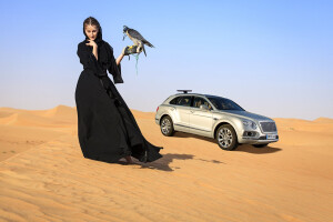 Bentley Bentayga falconer with woman and falcon