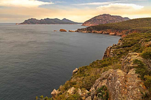 Coastline-from-Cape-Tourville-looking-back-towards-Mt-Dove-and-the-Freycinet-Peninsula