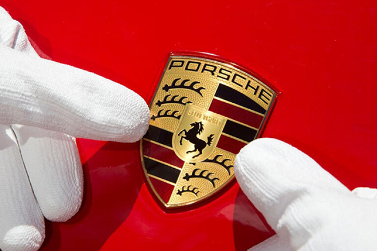 Porsche badge being applied