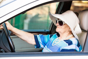 Elderly lady driving car