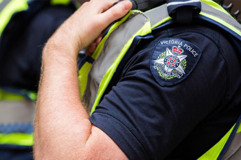 Victoria police badge on arm