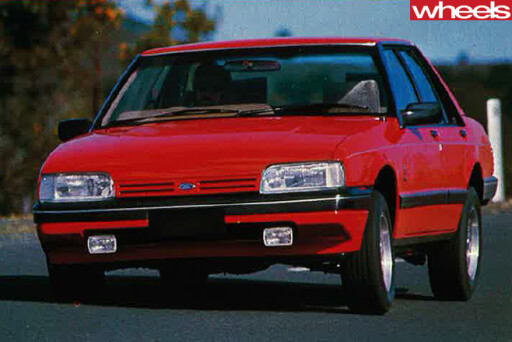 1984-Ford -Falcon -Ghia -driving -front -side