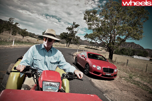 2013-Bentley -Continental -GT-with -guy -on -tractor