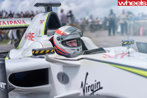 Driver -sitting -in -smokey -F1-Car -Goodwood -festival -of -speed