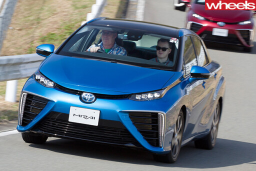 Blue -Toyota -Mirai -hydrogen -fuel -cell -vehicle -entering -corner -driving