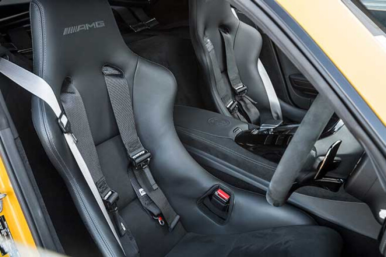 AMG Performance seats with four-point harnesses.