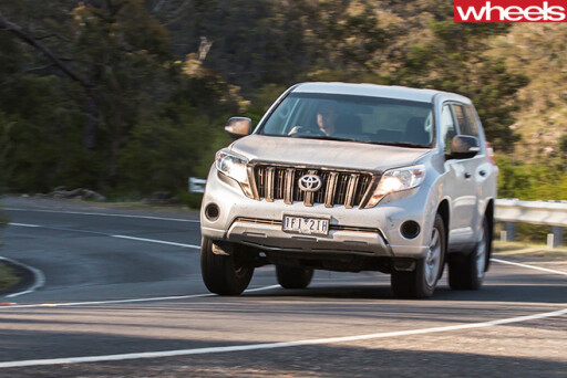 Toyota -Prado -driving -on -road -front -side